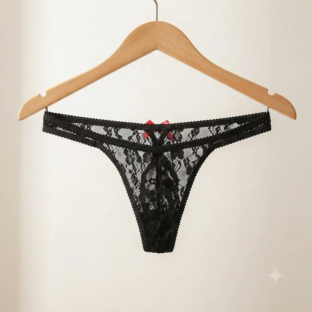 Black floral lace thong displayed on hanger