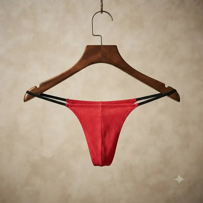 Red men's double-strap thong displayed on hanger