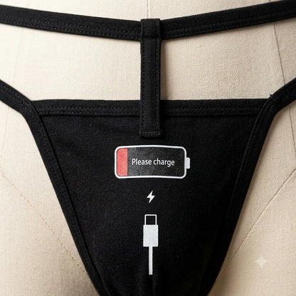 Close-up of Please charge low-battery graphic on black women's thong