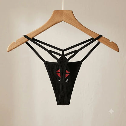 Women's black multi-strap thong displayed on hanger