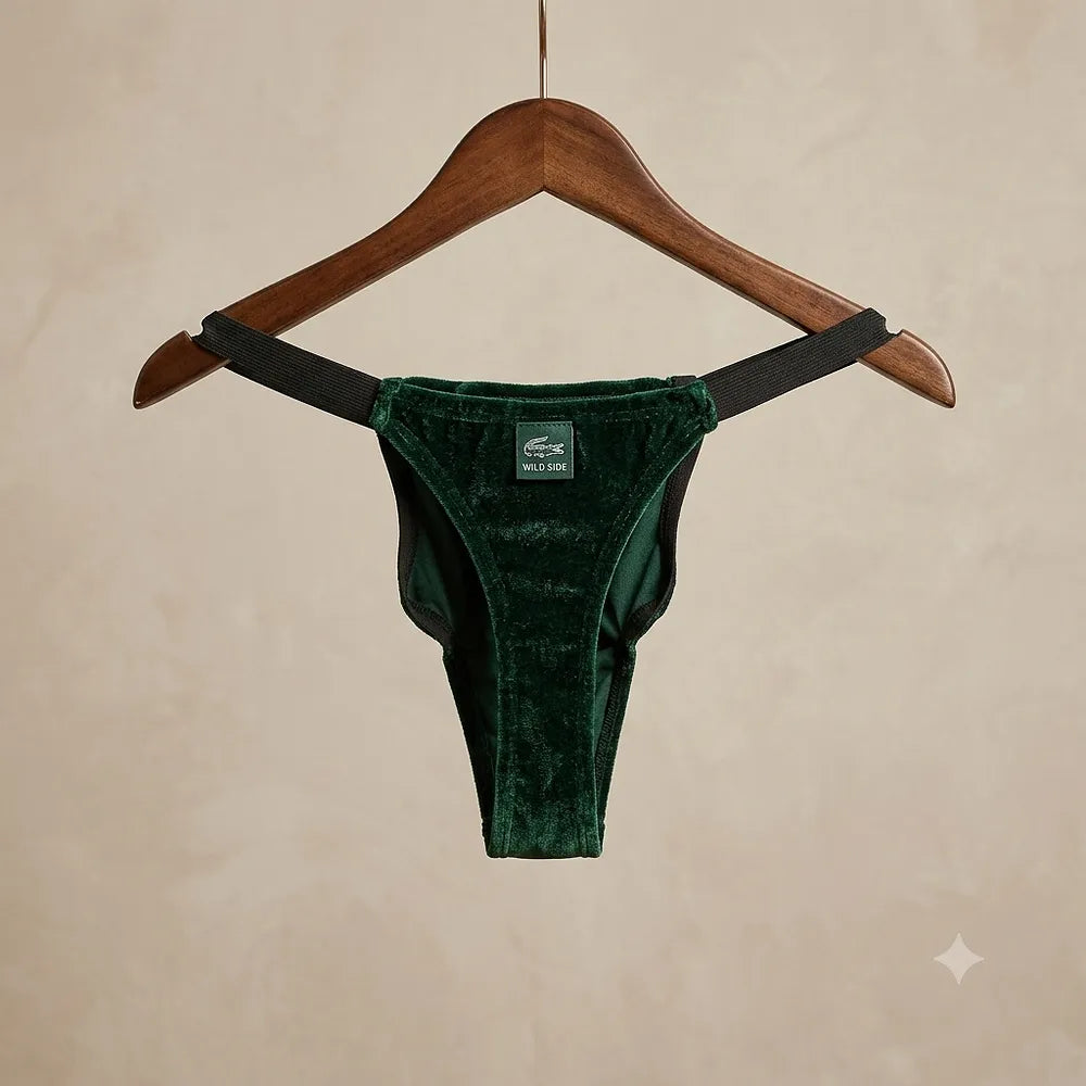 Green crocodile novelty underwear displayed on hanger