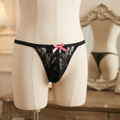 Women's black floral lace thong front view with pink bow