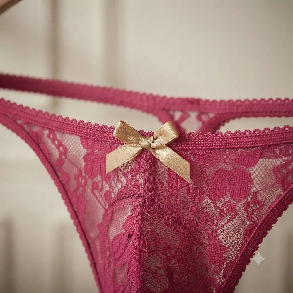 Close-up of deep pink floral lace and bow detail
