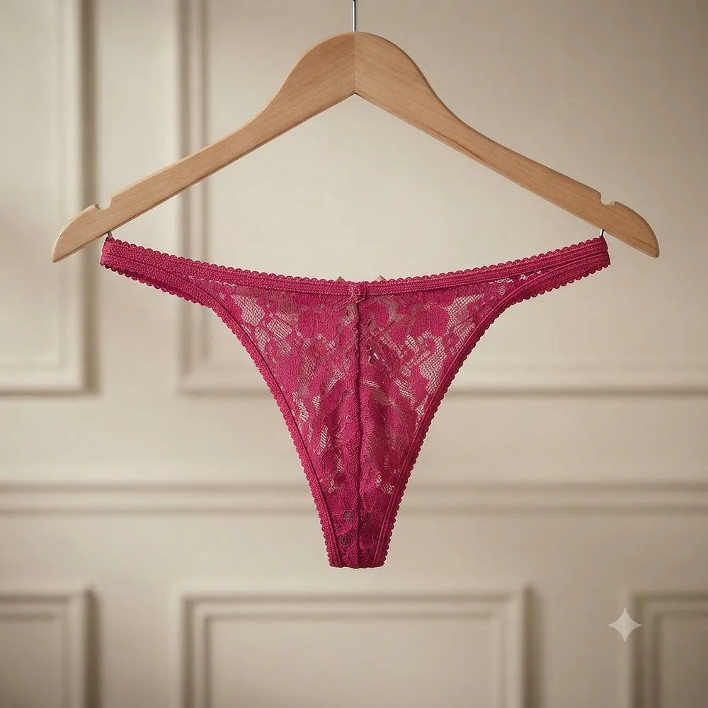Deep pink floral lace thong displayed on hanger