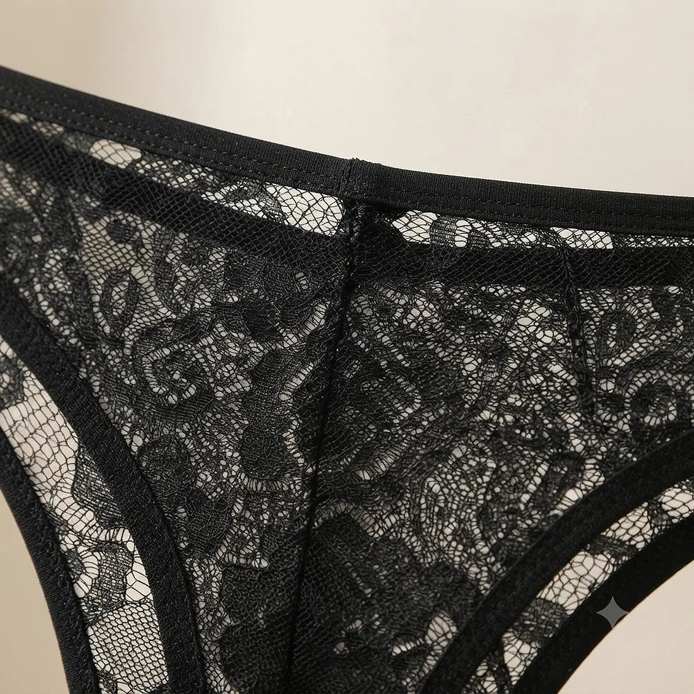 Black lace thong displayed on hanger