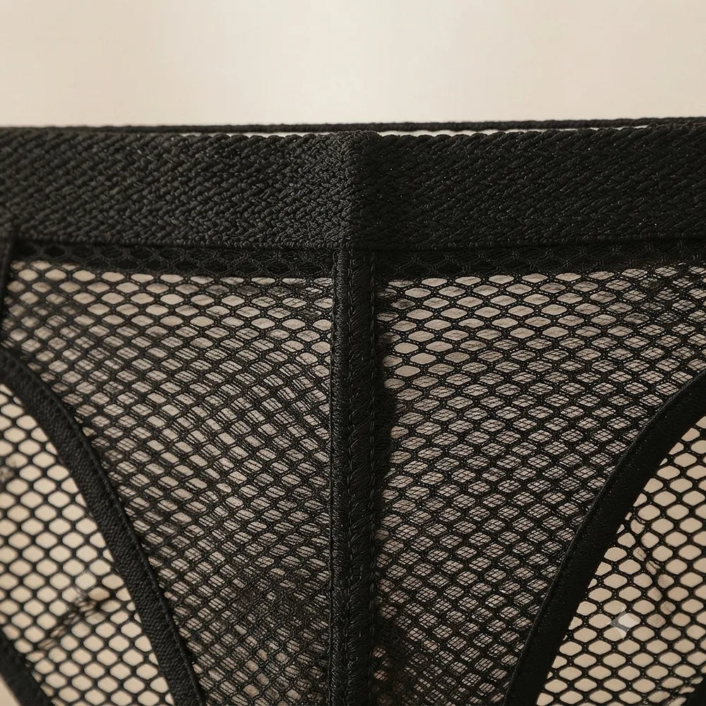 Close-up of open mesh panel construction and wide black waistband