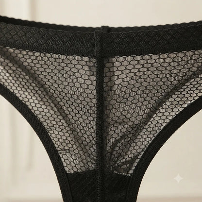 Detailed close-up of black mesh brief construction